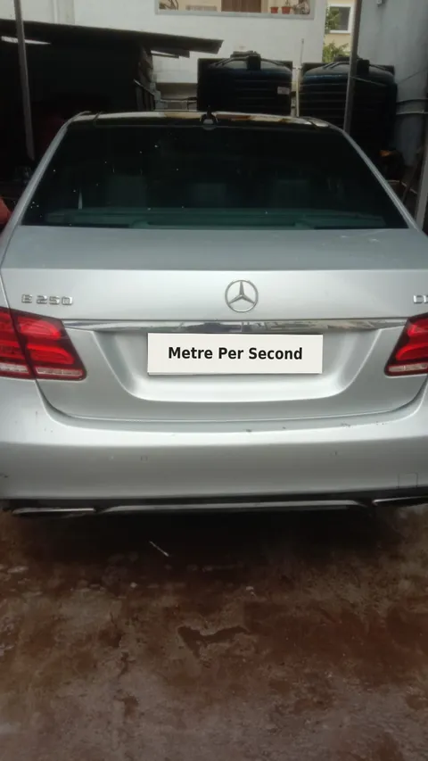 Silver Mercedes-Benz E 250 CDI with a Metre Per Second privacy plate