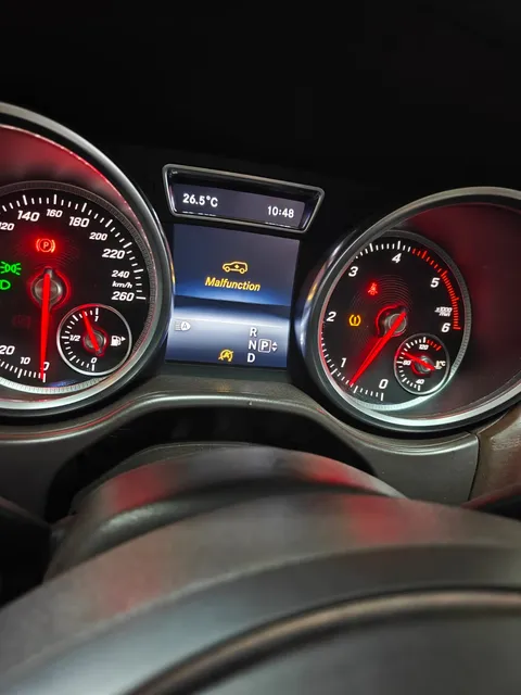 Mercedes-Benz instrument cluster showing a suspension-related malfunction warning
