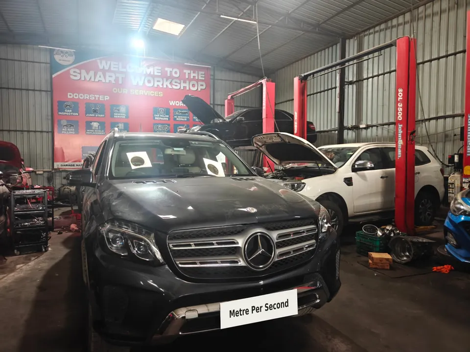 Mercedes-Benz SUV inside the Metre Per Second workshop with registration masked