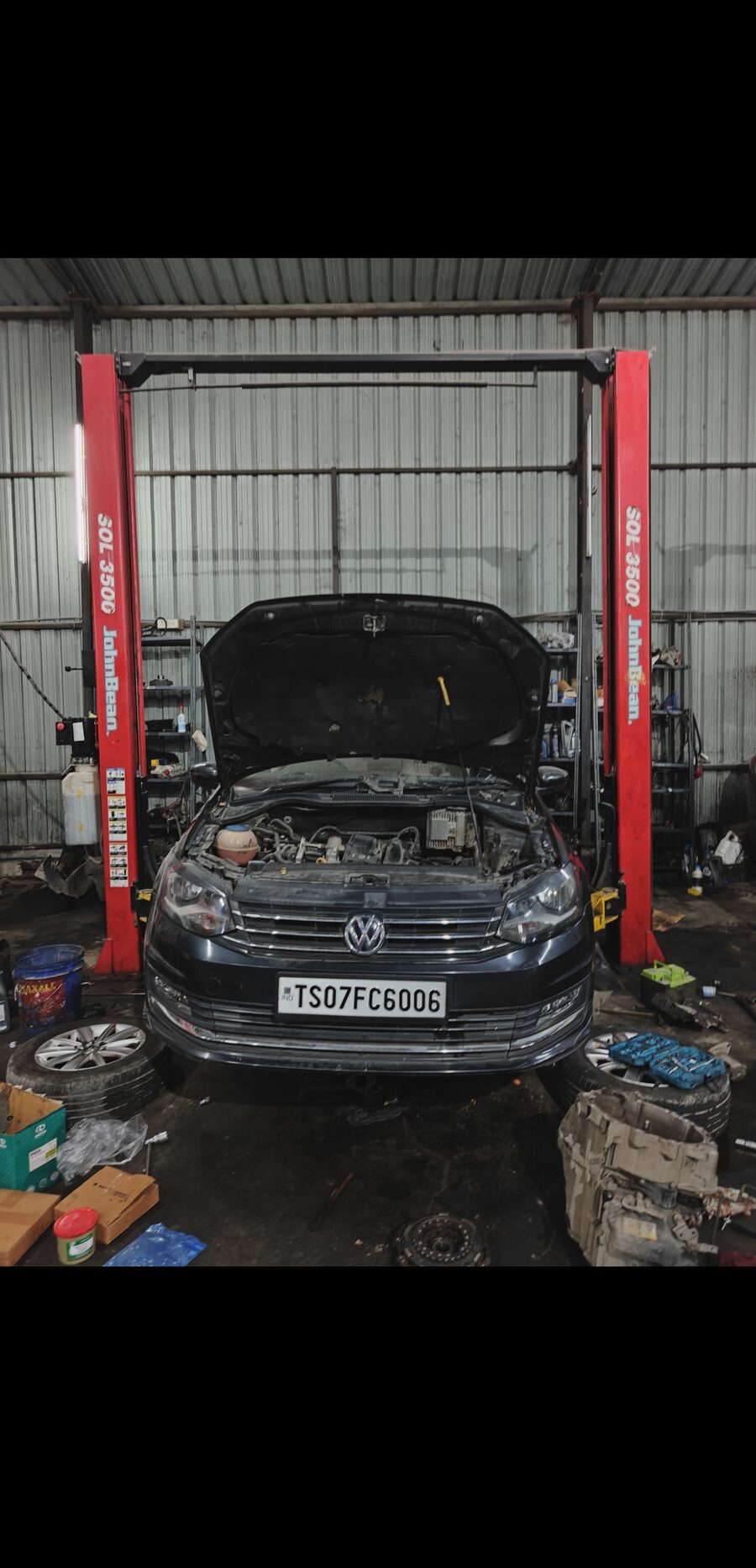 Technician working on a vehicle at MPS specialist workshop Hyderabad