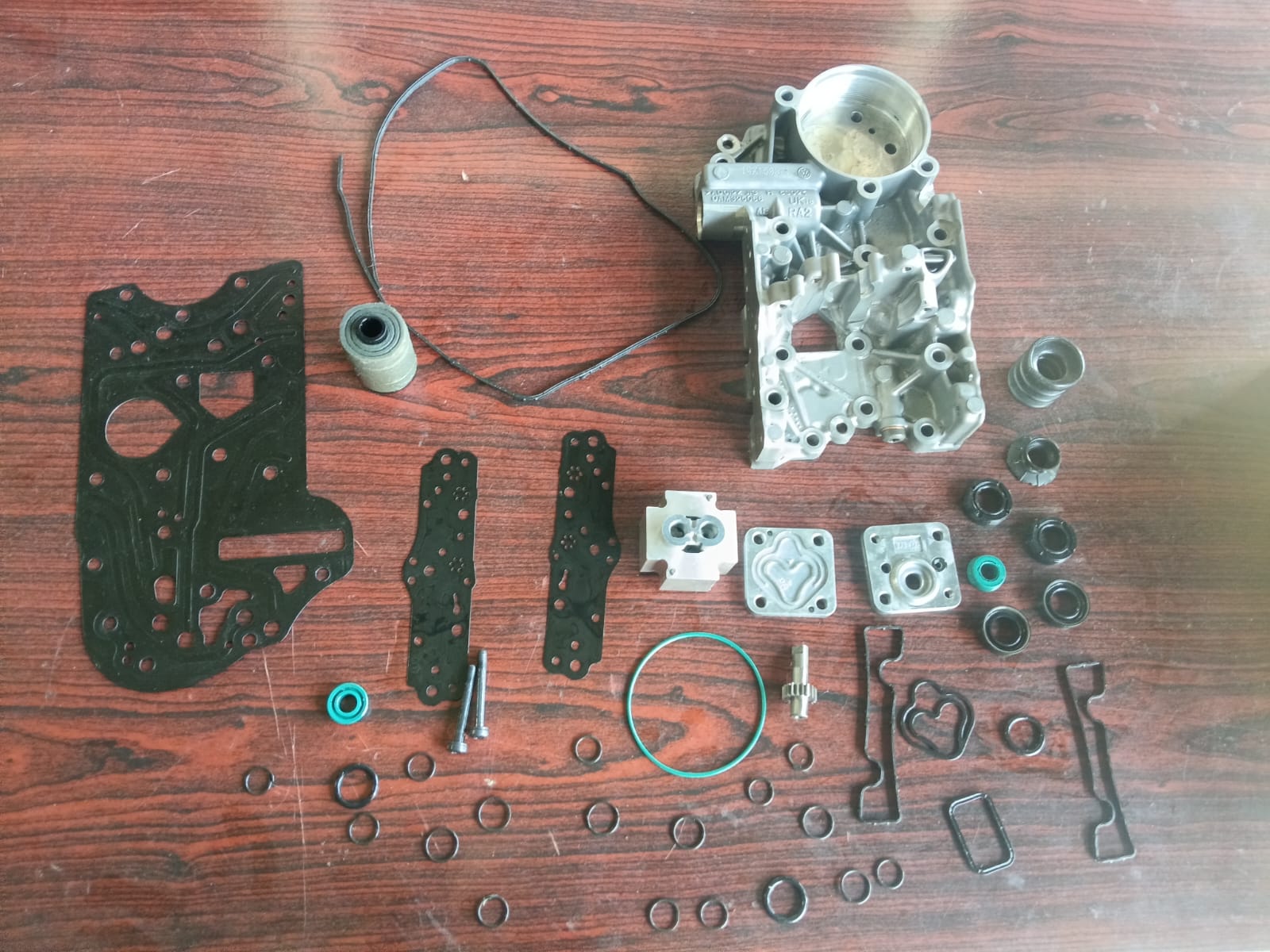 DSG mechatronics valve-body components laid out for inspection